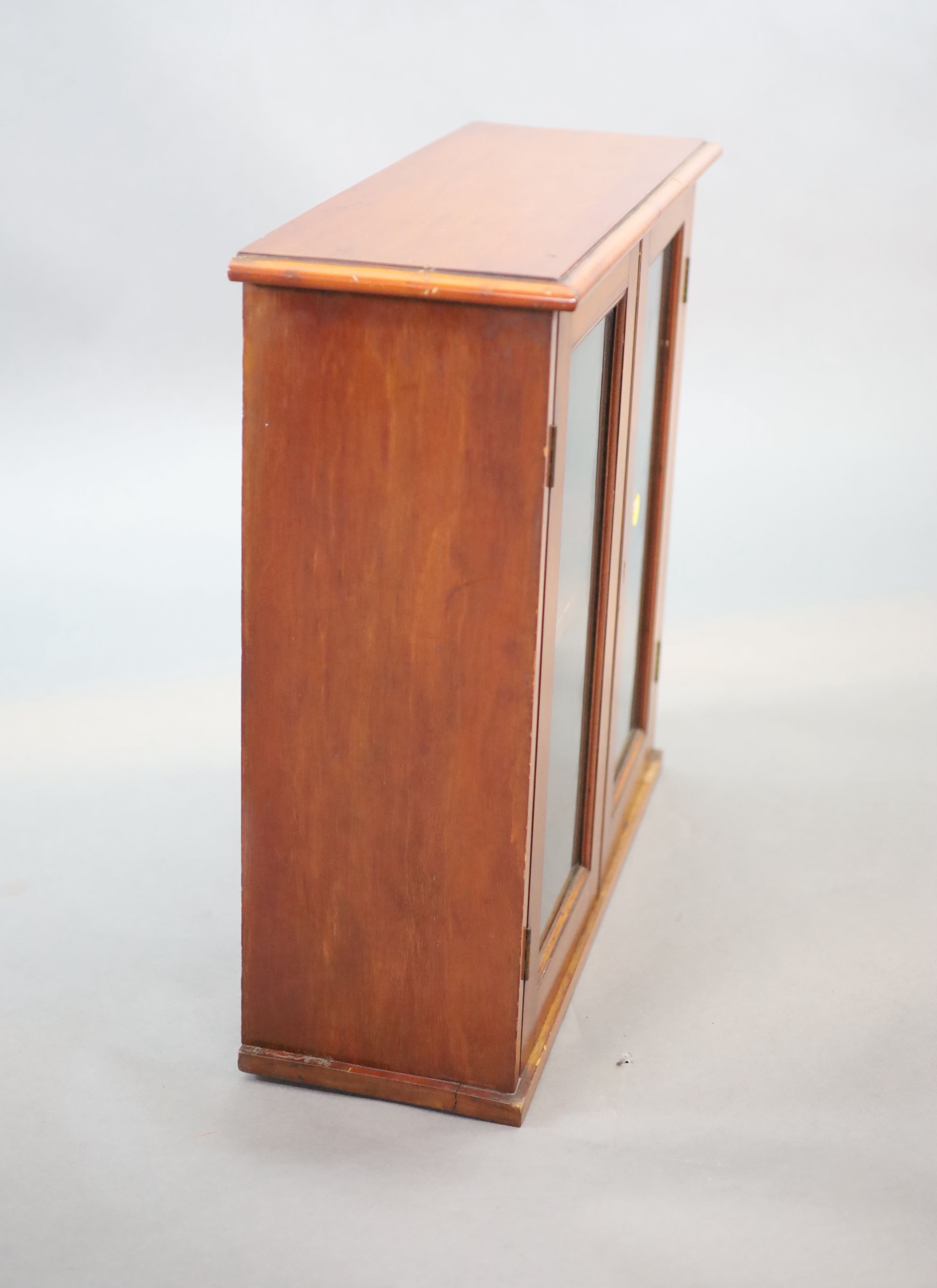 A small Edwardian mahogany wall cabinet, W.58cm D.21cm H.57cm